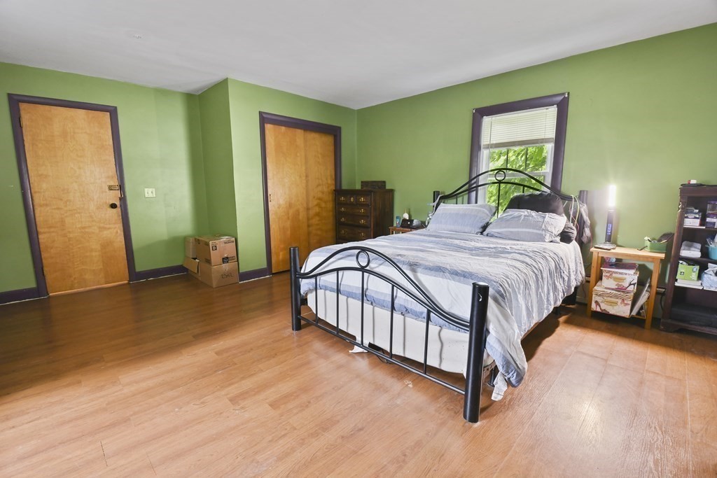 9 Dervin Place Clinton, MA 01510 - Photo 12 of 20 a bedroom with a bed table and a window
