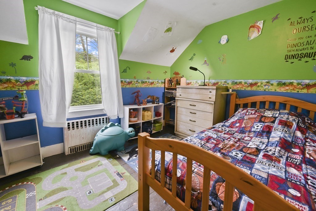 9 Dervin Place Clinton, MA 01510 - Photo 16 of 20 a bedroom with furniture and a large window