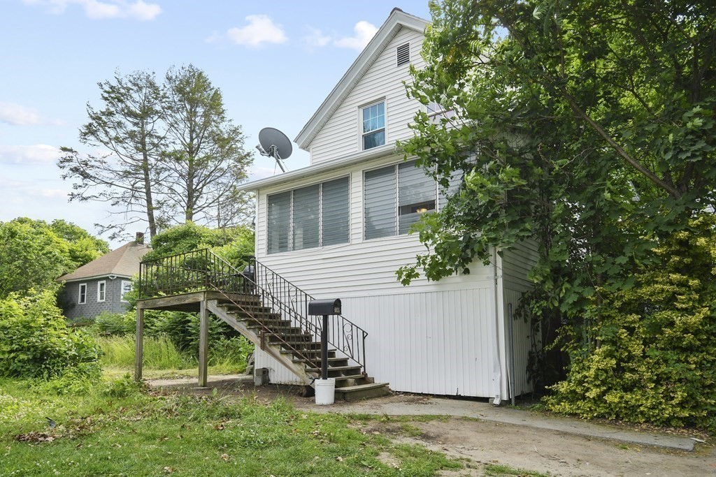 9 Dervin Place Clinton, MA 01510 - Photo 19 of 20 a view of a house with backyard and plants