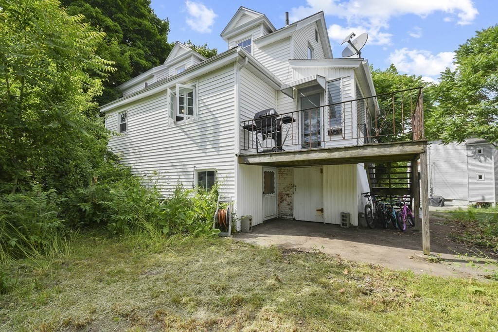 9 Dervin Place Clinton, MA 01510 - Photo 20 of 20 front view of a house with a garden