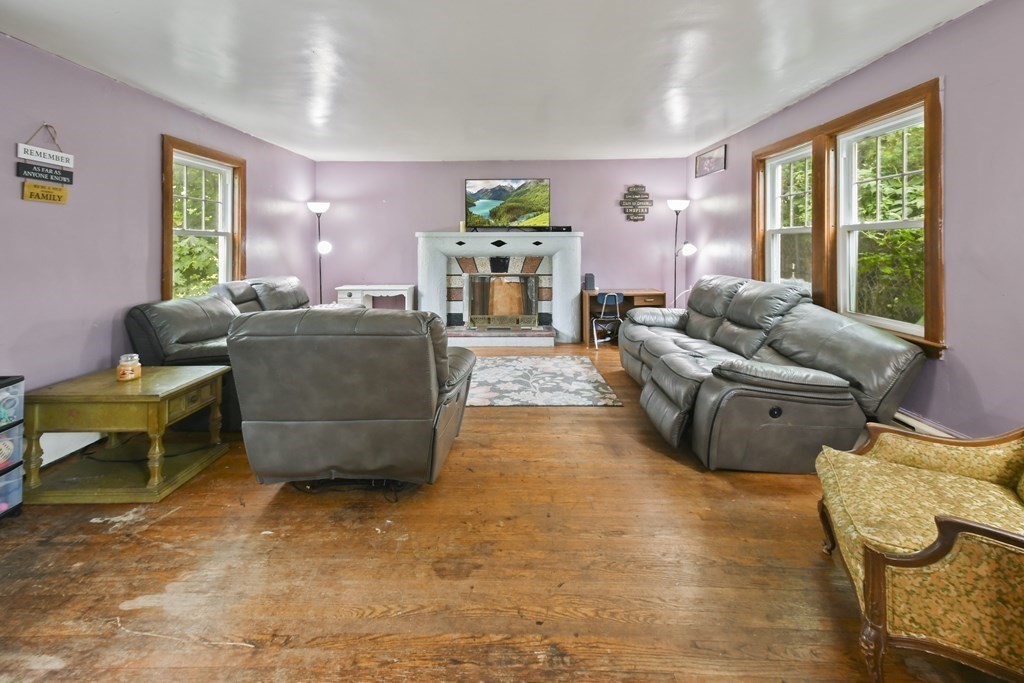 9 Dervin Place Clinton, MA 01510 - Photo 2 of 20 a living room with furniture and a large window