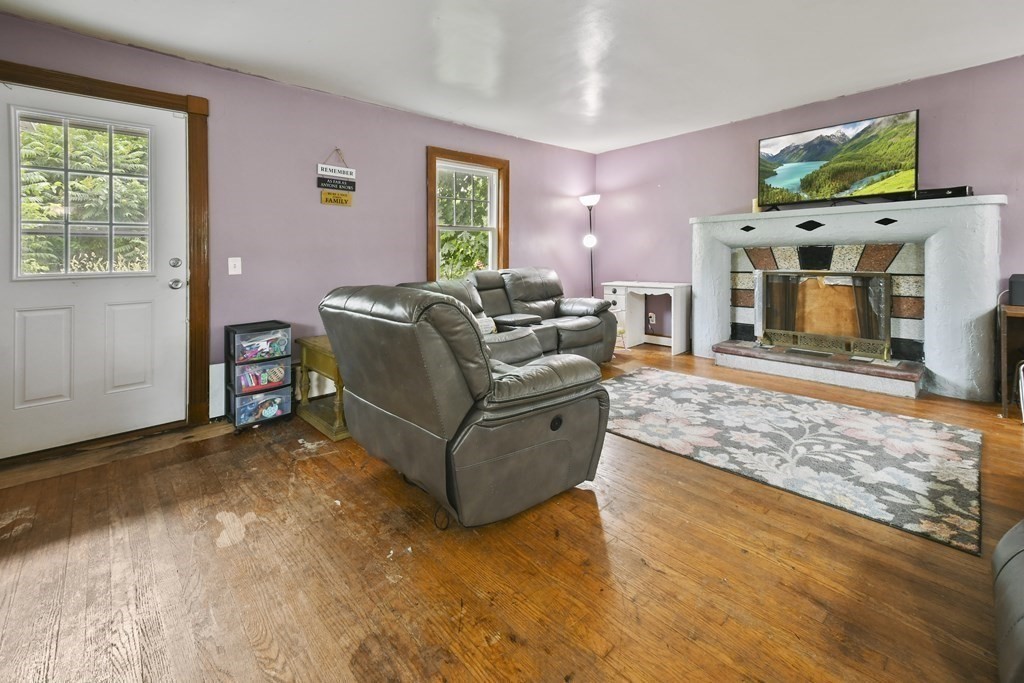 9 Dervin Place Clinton, MA 01510 - Photo 3 of 20 a living room with furniture and a fireplace