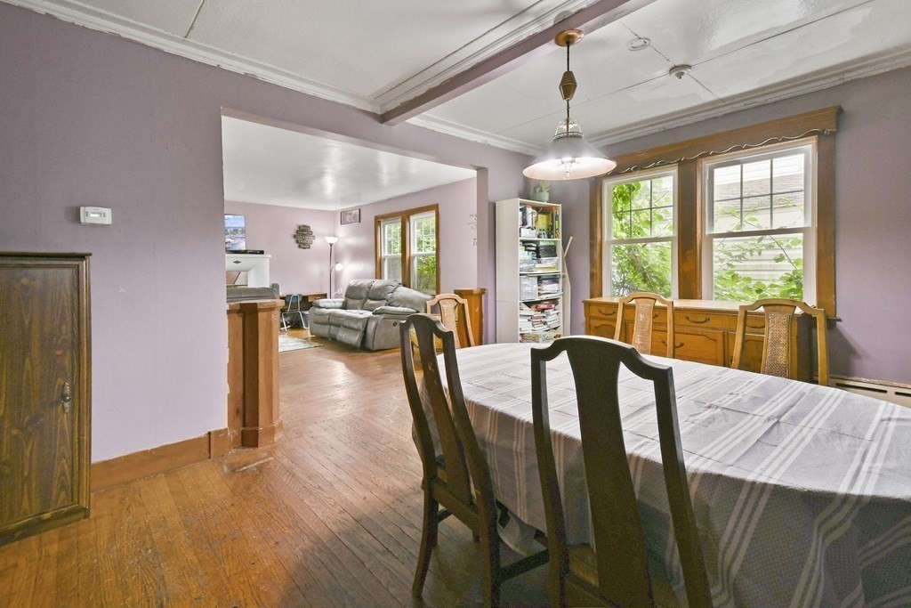9 Dervin Place Clinton, MA 01510 - Photo 7 of 20 a view of a dining room with furniture window and wooden floor