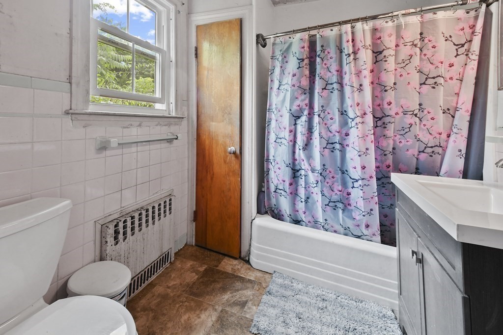 9 Dervin Place Clinton, MA 01510 - Photo 10 of 20 a bathroom with a toilet and a shower curtain