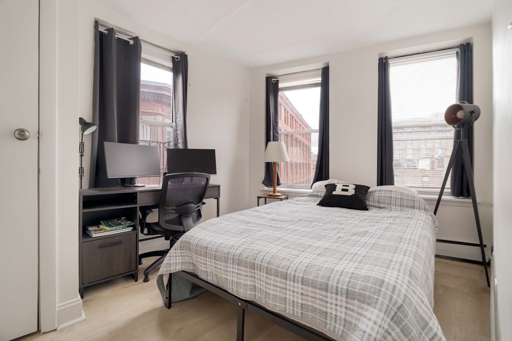 5 North Margin Street, Unit 9 Boston, MA 02113 - Photo 7 of 17 a bedroom with a bed and a window