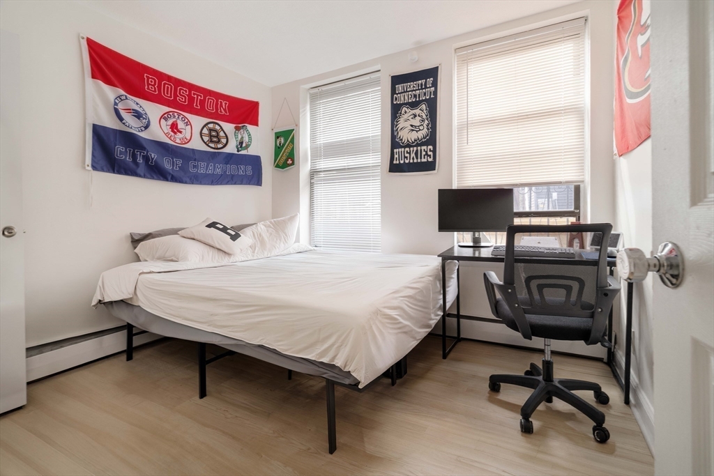 5 North Margin Street, Unit 9 Boston, MA 02113 - Photo 8 of 17 a bedroom with a bed and a desk