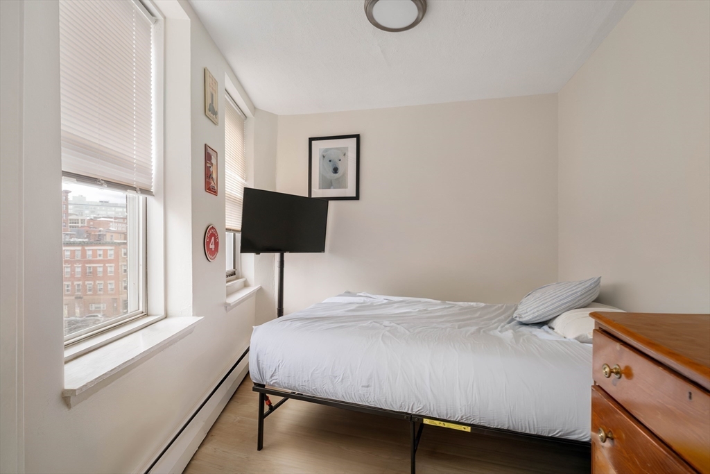 5 North Margin Street, Unit 9 Boston, MA 02113 - Photo 9 of 17 a bedroom with a bed and a lamp