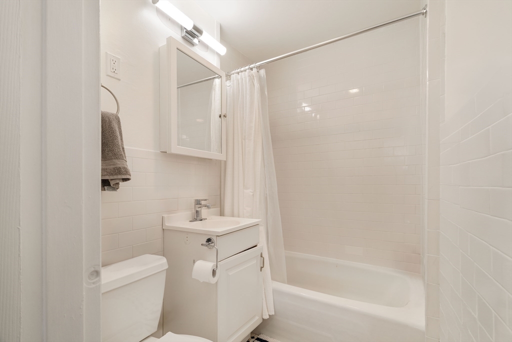 5 North Margin Street, Unit 9 Boston, MA 02113 - Photo 10 of 17 a bathroom with a sink toilet and shower