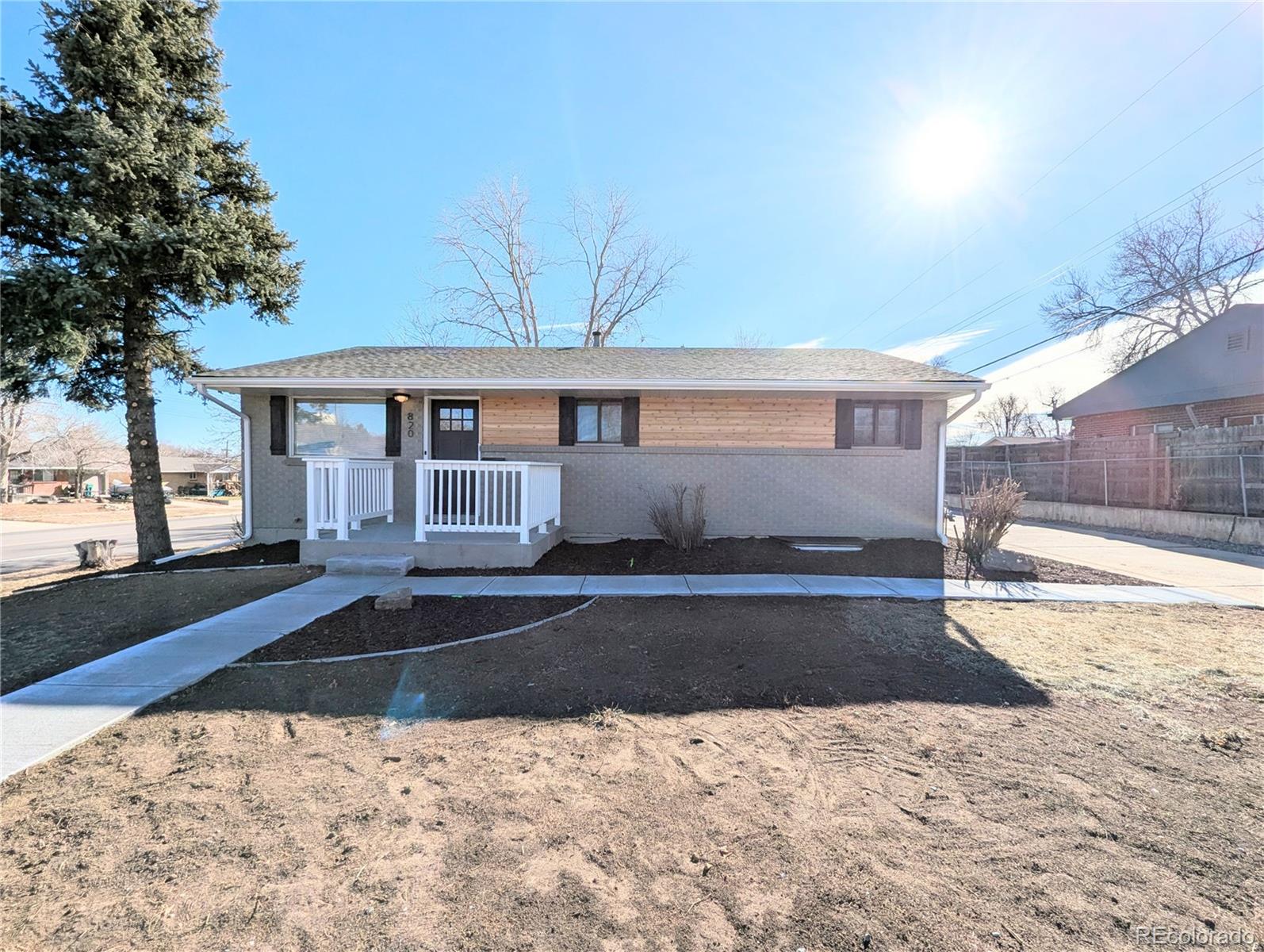 820 Drake Street Denver, CO 80221 - Photo 1 of 48 a front view of a house with a yard and garage