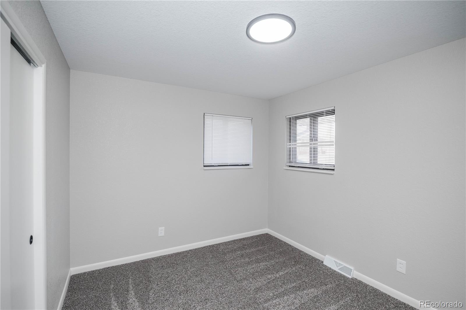 820 Drake Street Denver, CO 80221 - Photo 15 of 48 an empty room with windows