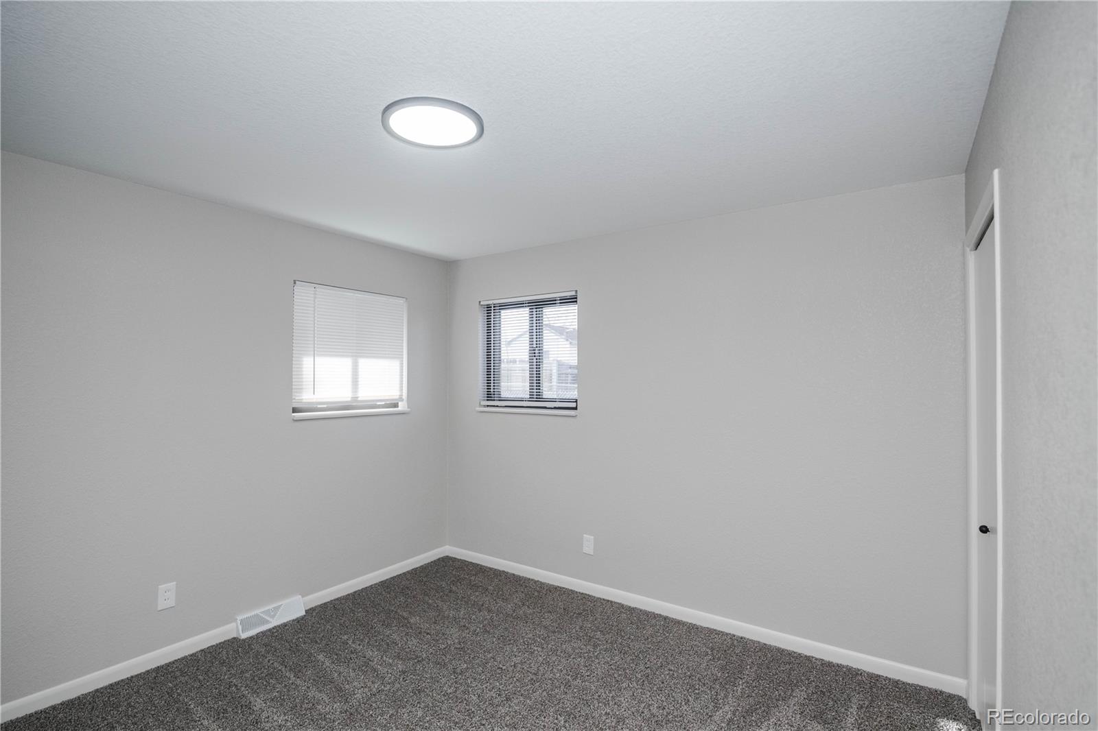 820 Drake Street Denver, CO 80221 - Photo 16 of 48 a view of an empty room with a window