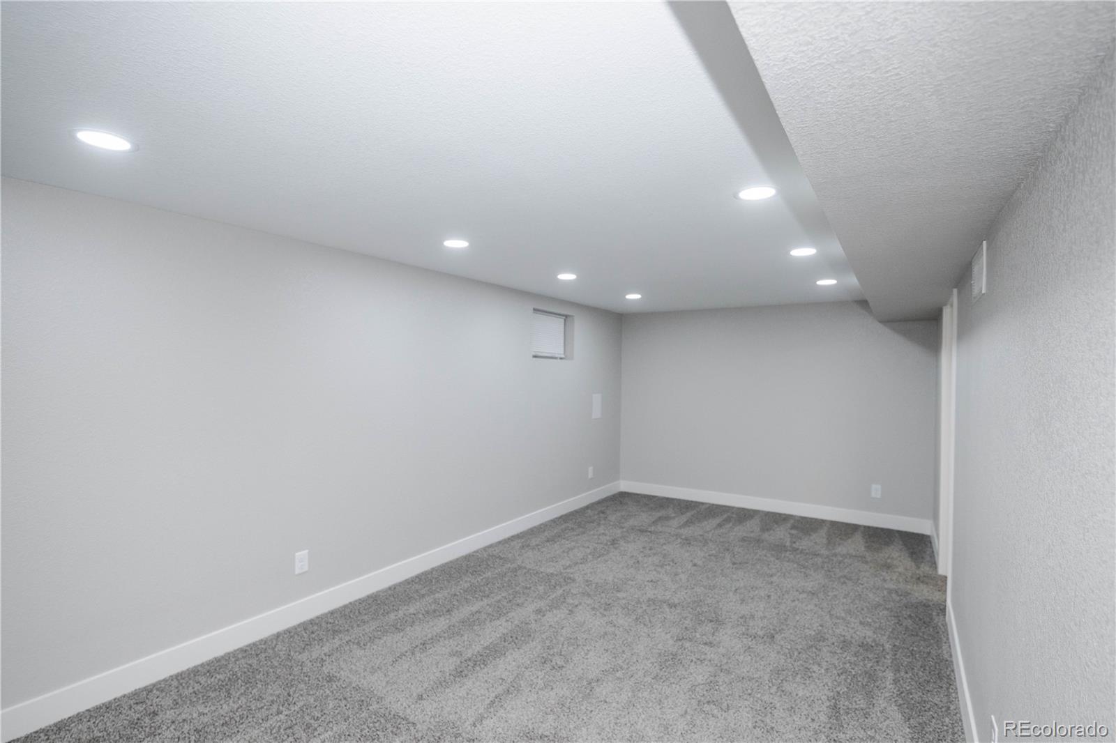 820 Drake Street Denver, CO 80221 - Photo 22 of 48 an empty room with a window