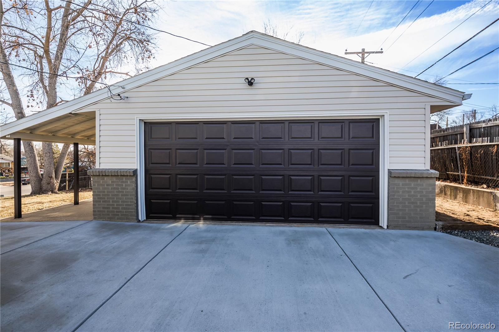 820 Drake Street Denver, CO 80221 - Photo 35 of 48 a view of a house with a garage