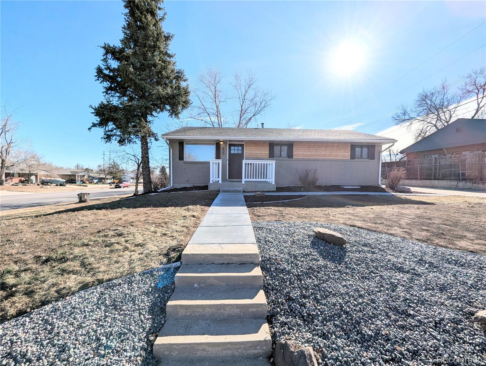 820 Drake Street Denver, CO 80221 - Photo 41 of 48 a front view of a house with a yard