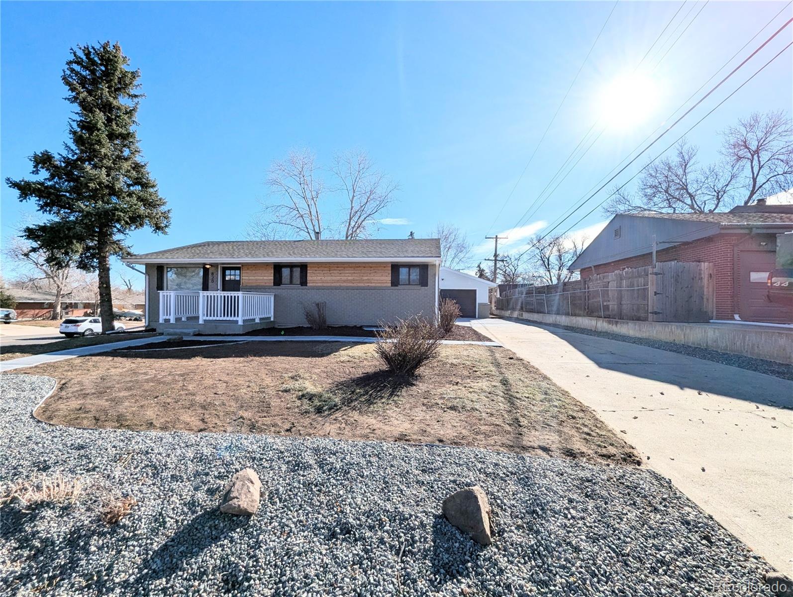 820 Drake Street Denver, CO 80221 - Photo 43 of 48 a view of a house with a yard covered with snow in the background