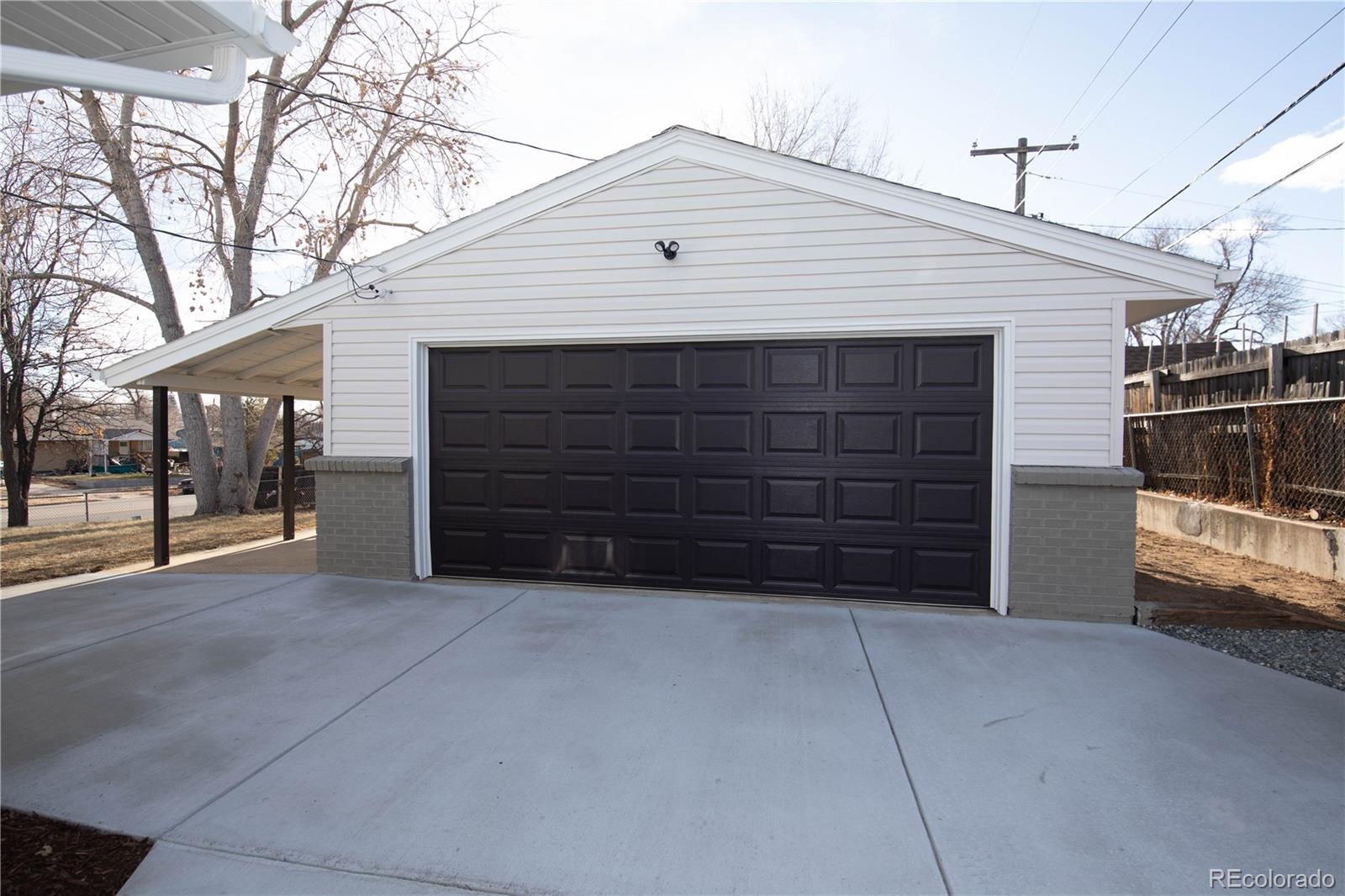 820 Drake Street Denver, CO 80221 - Photo 44 of 48 a view of a house with a garage