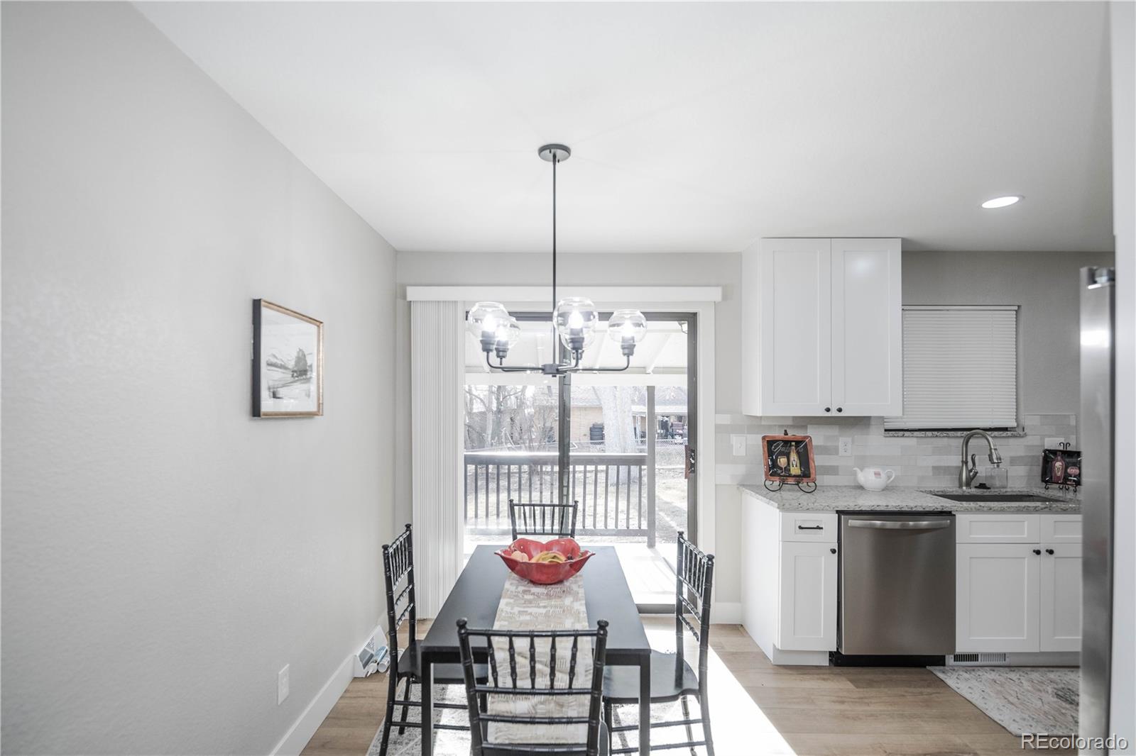 820 Drake Street Denver, CO 80221 - Photo 7 of 48 a kitchen with stainless steel appliances granite countertop a sink and a window