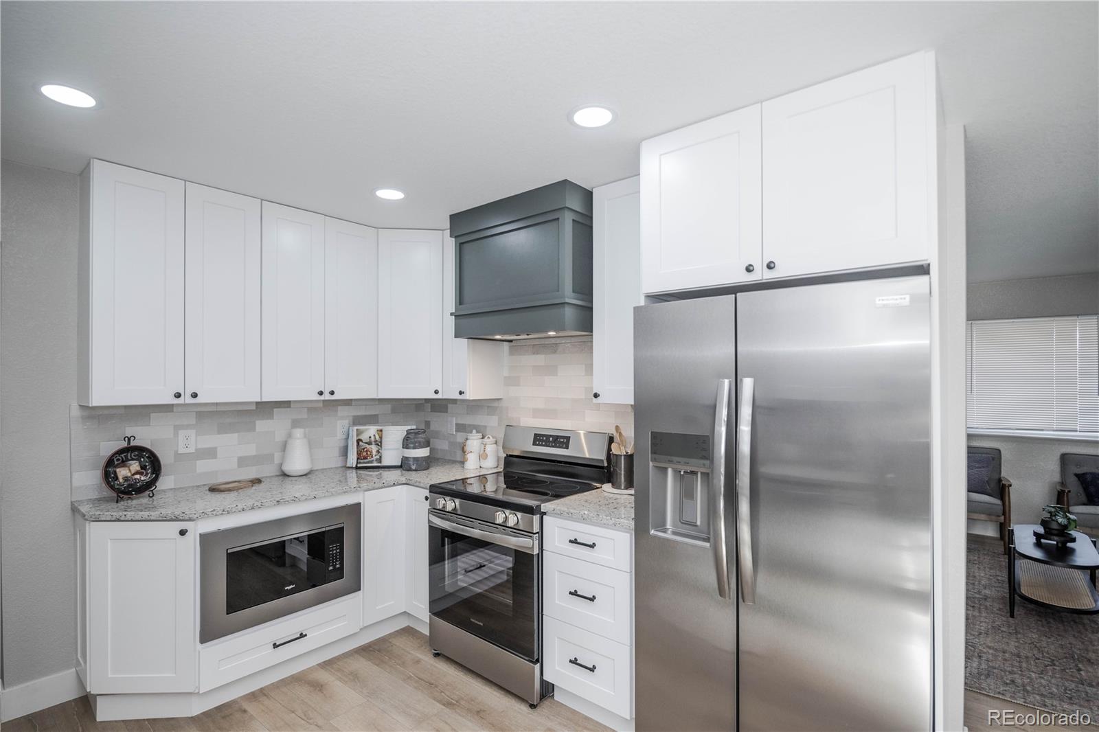 820 Drake Street Denver, CO 80221 - Photo 10 of 48 a kitchen with a refrigerator stove and microwave