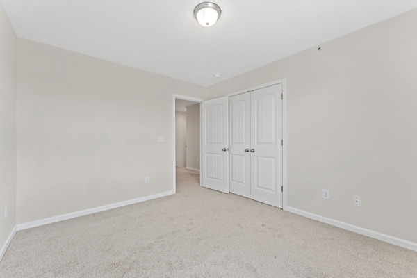 249 Samuel Street Pendleton, SC 29670 - Photo 19 of 33 Bedroom#2 This spacious bedroom offers ample natural light and a neutral palette, ready for personalization.
