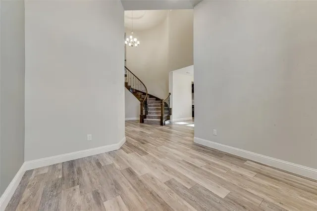 a view of a room with wooden floor and staircase