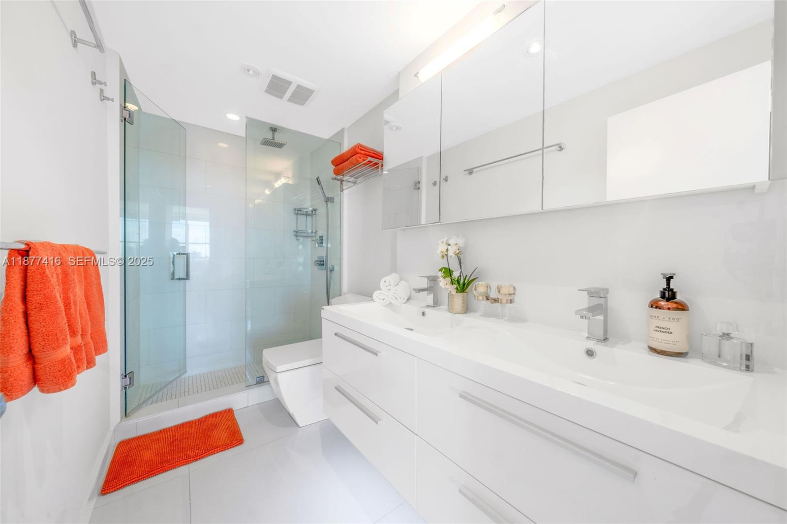 3 Island Avenue, Unit 10D Miami Beach, FL 33139 - Photo 12 of 23 a bathroom with a sink a toilet and shower