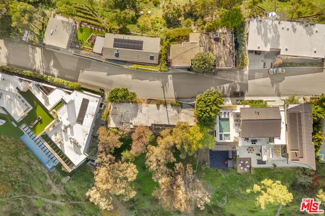 a balcony with table and chairs
