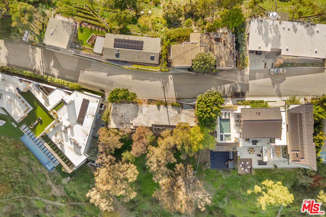 a balcony with table and chairs