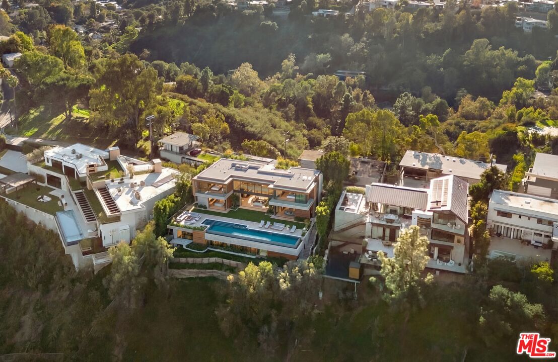 1128 North Tigertail Road Los Angeles, CA 90049 - Photo 5 of 7 a balcony with boat and lake view