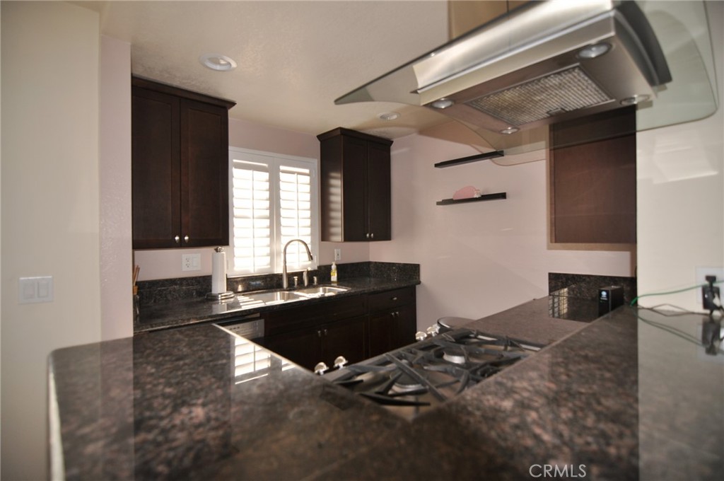 249 Alpine Street, Unit 48 Pasadena, CA 91106 - Photo 10 of 14 a kitchen with a sink and a stove top oven
