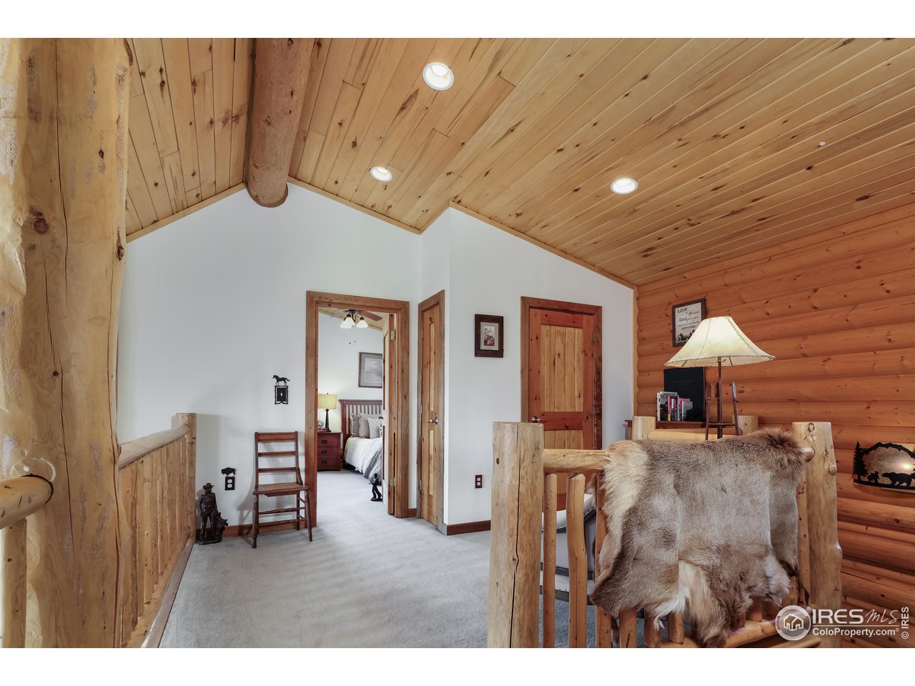 370 Blue Mountain Trail Lyons, CO 80540 - Photo 19 of 37 a view of a livingroom with furniture and cabinet