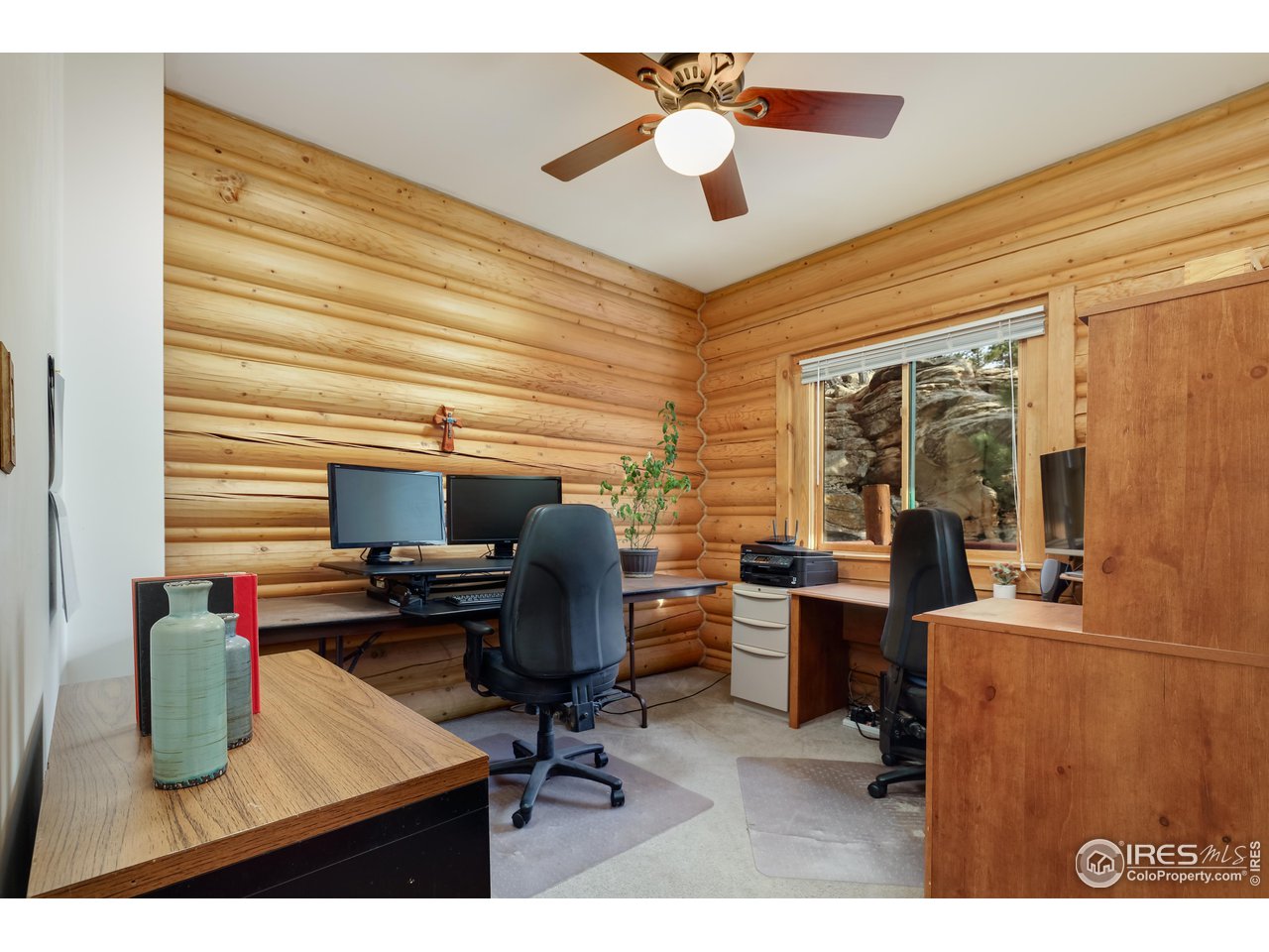 370 Blue Mountain Trail Lyons, CO 80540 - Photo 20 of 37 a view of a workspace with furniture and a window