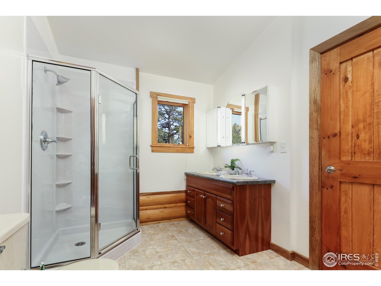 370 Blue Mountain Trail Lyons, CO 80540 - Photo 22 of 37 a workspace room with wooden floor and cabinet
