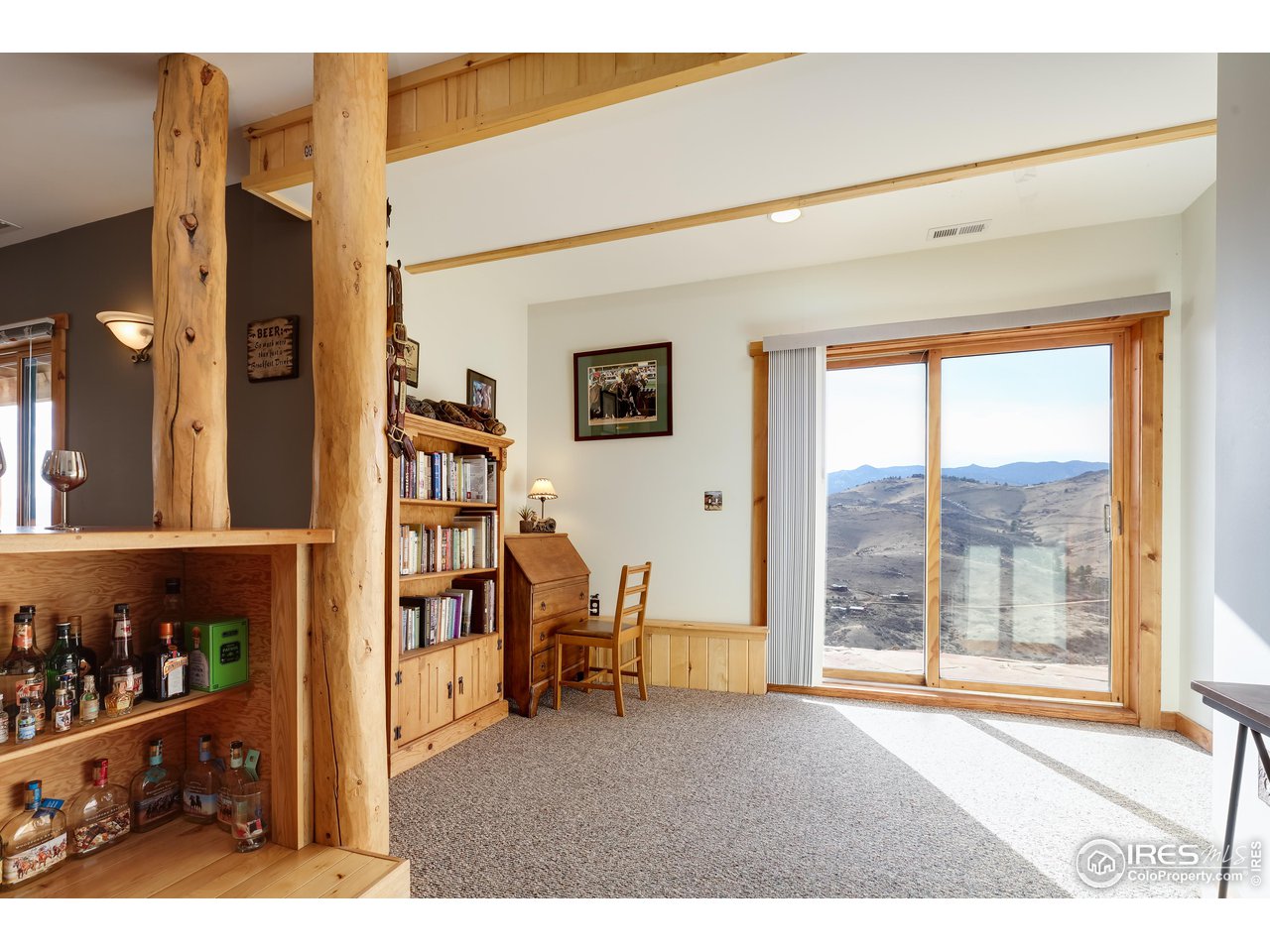 370 Blue Mountain Trail Lyons, CO 80540 - Photo 24 of 37 a view of livingroom with furniture and floor to ceiling window