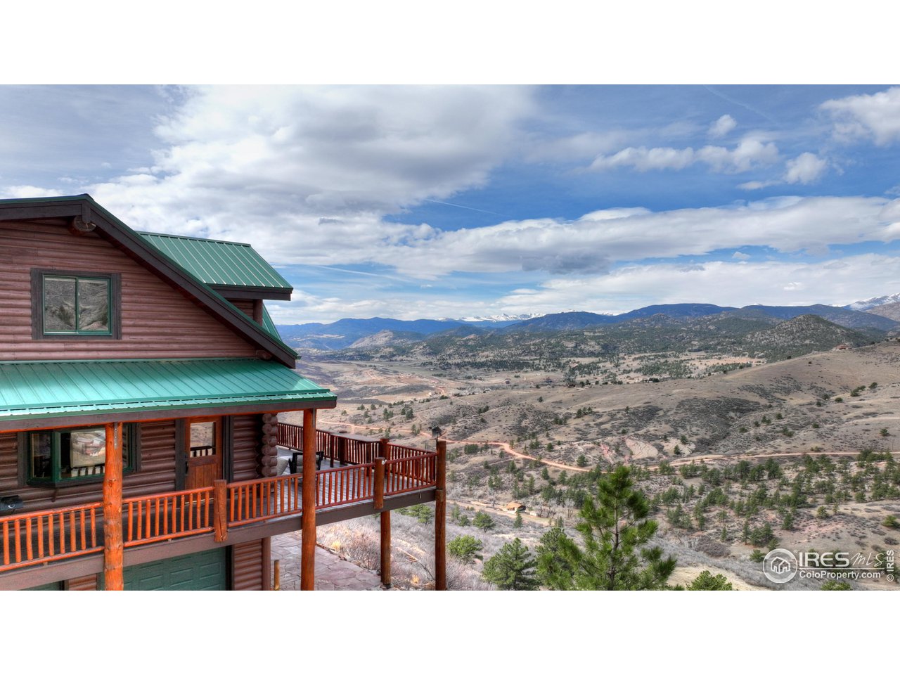 370 Blue Mountain Trail Lyons, CO 80540 - Photo 36 of 37 a balcony with furniture and a potted plant