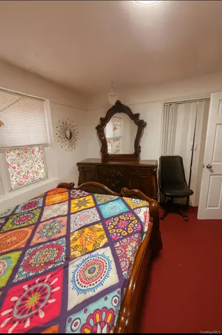 a living room with a bed and furniture