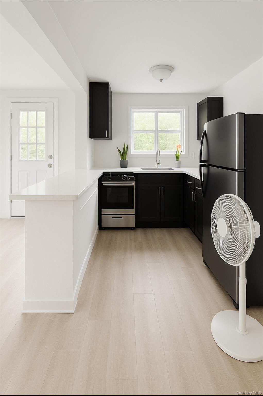 932 Adee Avenue Bronx, NY 10469 - Photo 5 of 9 a living room with a couch and a flat screen tv