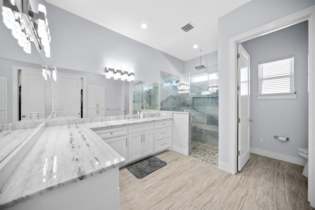 10405 Singleton Road Midlothian, TX 76065 - Photo 19 of 39 Bathroom featuring a marble finish shower, vanity, light wood finished floors, and recessed lighting
