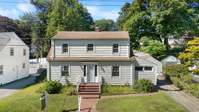 front view of a house with a yard