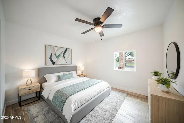 a bedroom with a bed and a window