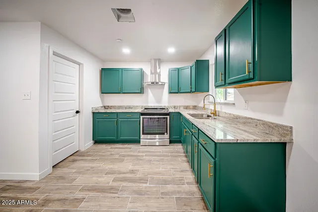 a kitchen with granite countertop a sink and cabinets