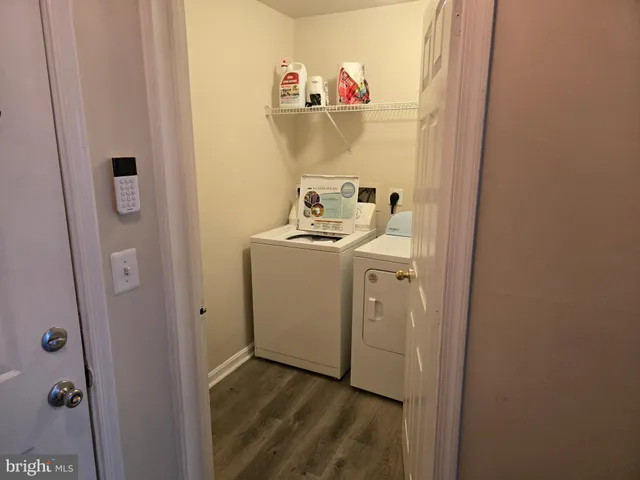 a view of storage and utility room with washer and dryer
