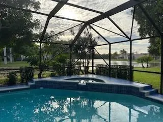 a view of yard with tree and patio