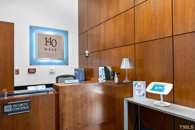 a kitchen with stainless steel appliances kitchen island granite countertop a sink cabinets and wooden floor
