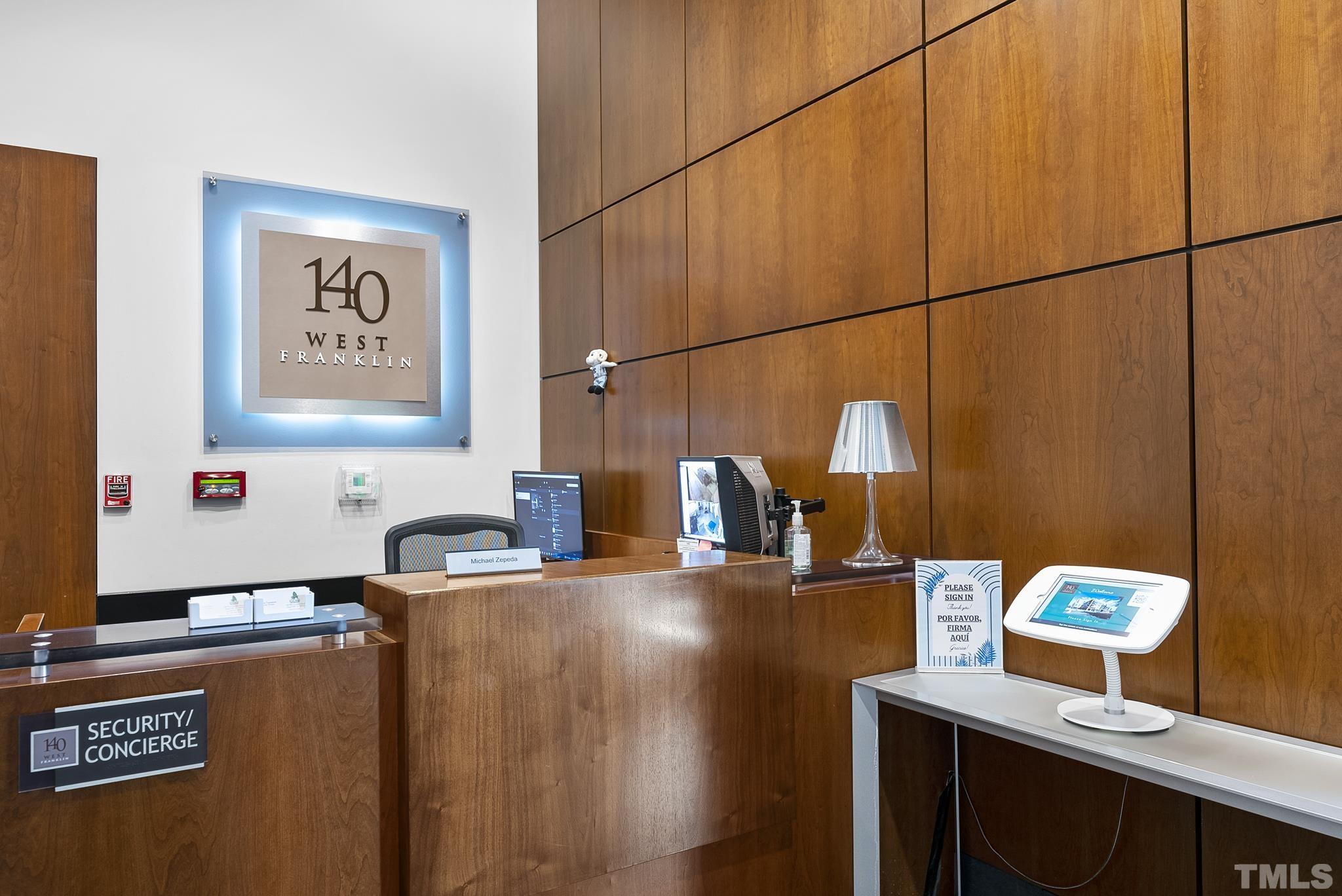 140 West Franklin Street, Unit 415 Chapel Hill, NC 27516 - Photo 2 of 29 a kitchen with stainless steel appliances kitchen island granite countertop a sink cabinets and wooden floor