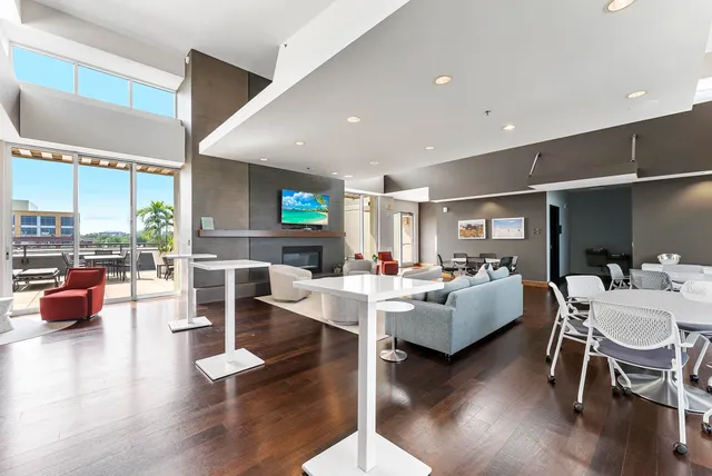 a living room with fireplace furniture and a wooden floor