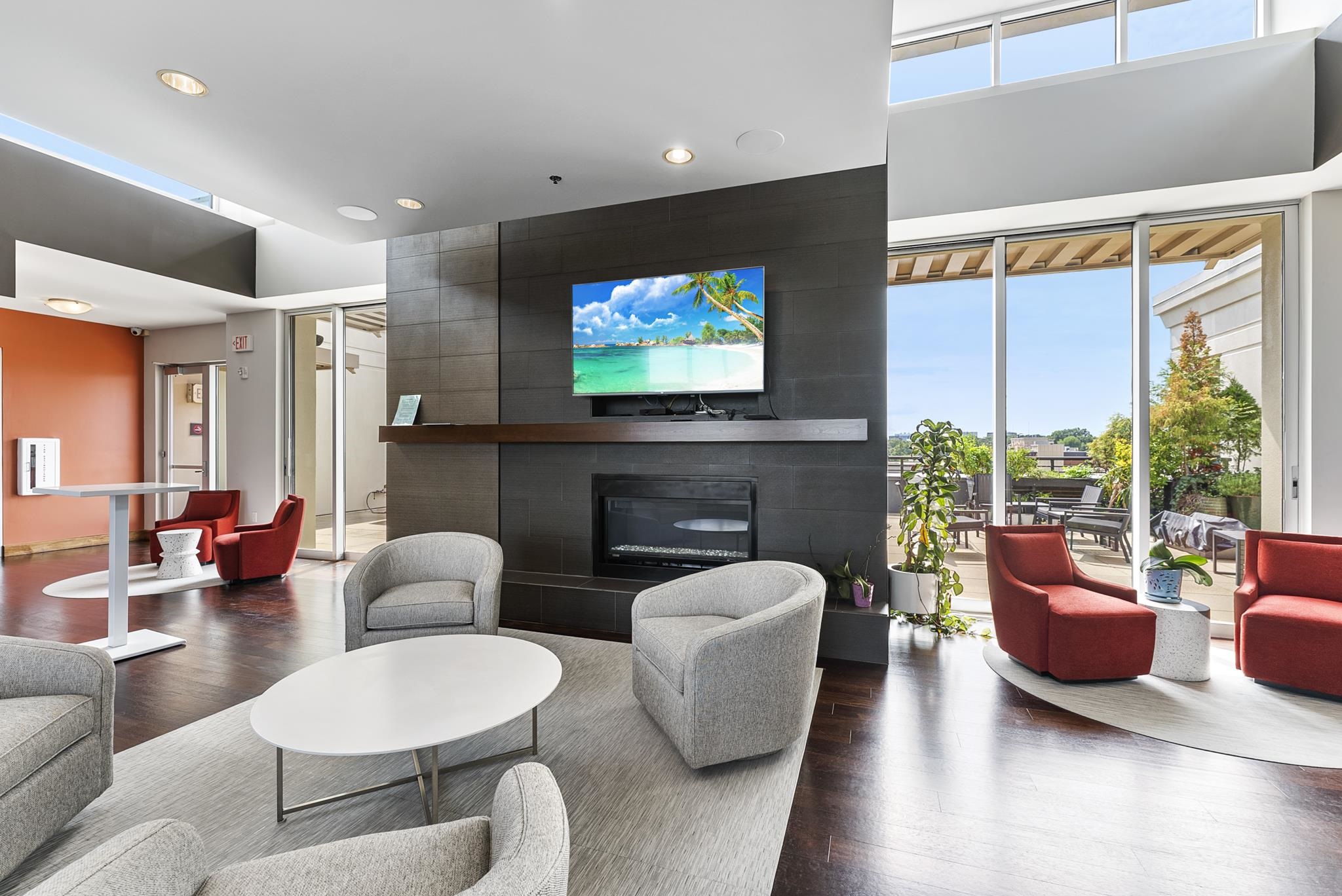 140 West Franklin Street, Unit 415 Chapel Hill, NC 27516 - Photo 23 of 29 a living room with furniture a flat screen tv and a large window