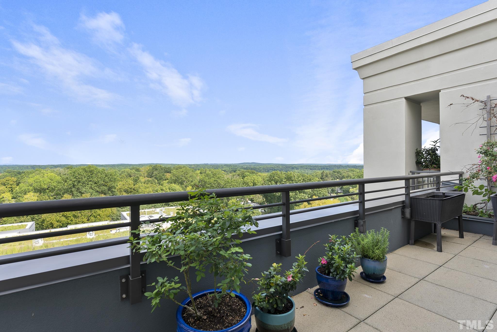 140 West Franklin Street, Unit 415 Chapel Hill, NC 27516 - Photo 26 of 29 a view of a chairs and tables in the balcony