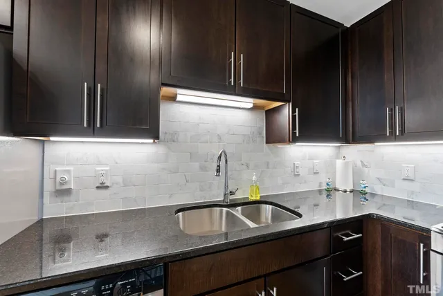 a kitchen with a sink and cabinets