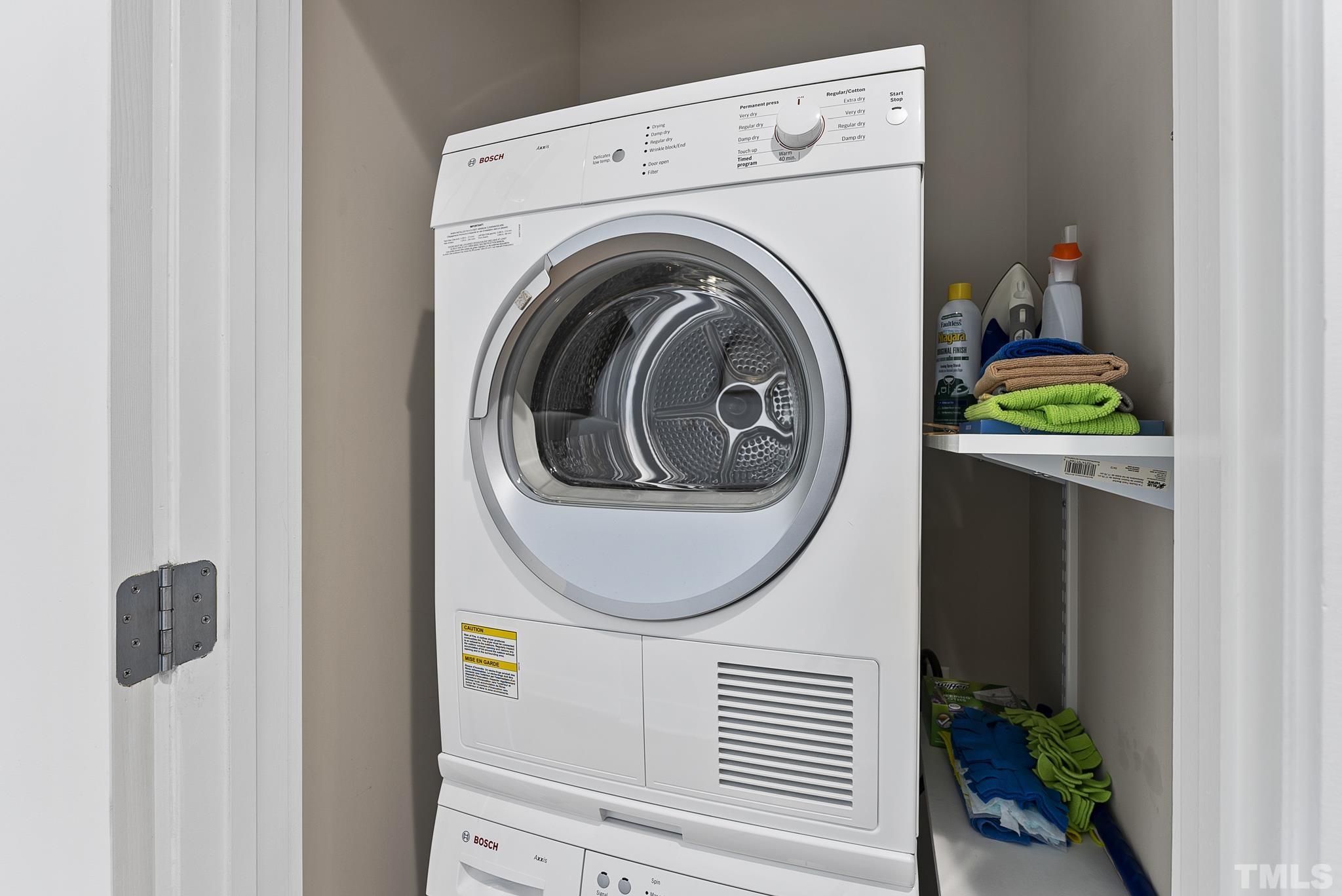 140 West Franklin Street, Unit 415 Chapel Hill, NC 27516 - Photo 10 of 29 a close view of a utility room with dryer and washer