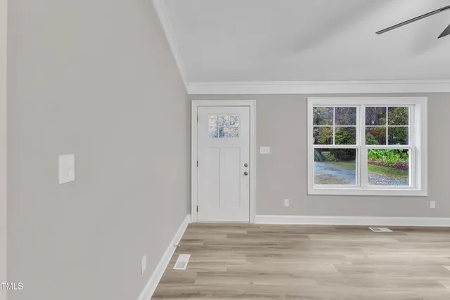 a view of a livingroom and window